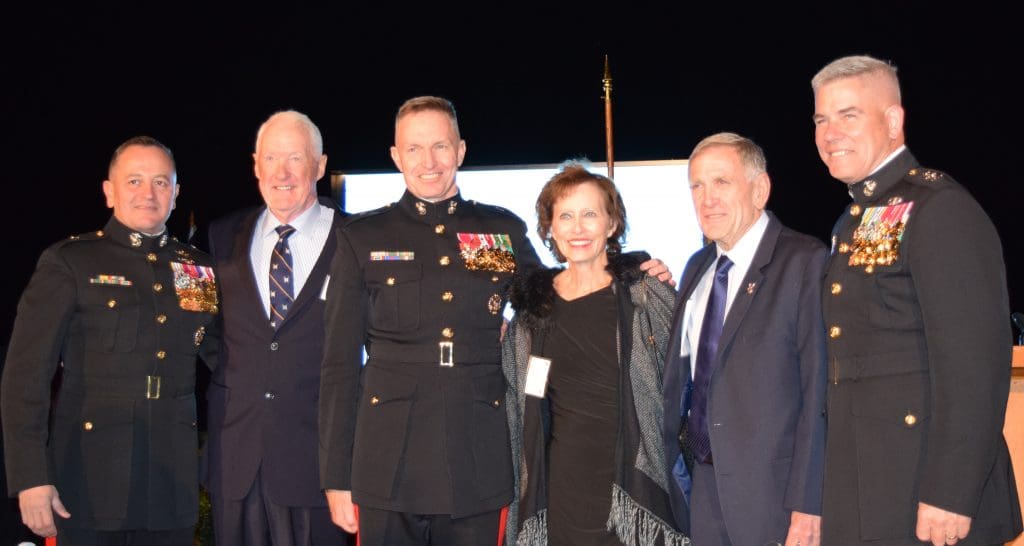 Group picture of LtGen Richard Mills USMC (Ret), Judge David O. Carter and his wife, Mary Ellen, and BGen Frank Quinlan USMC (Ret)