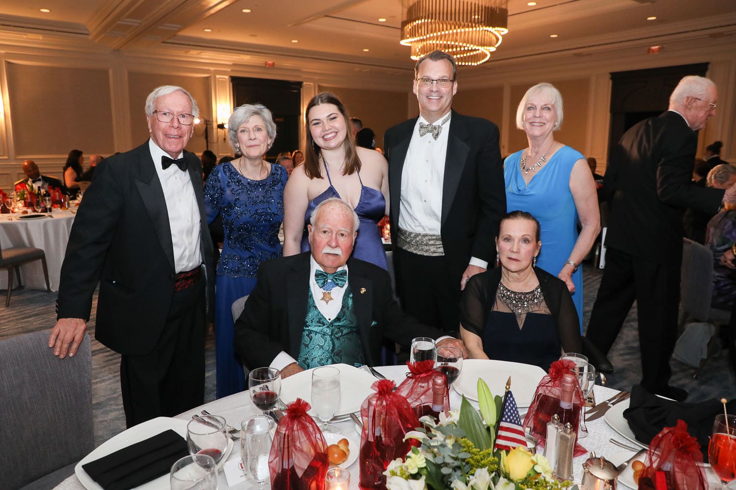 The family of 2022 Semper Fidelis Guest of Honor Barney Barnum gather round the table